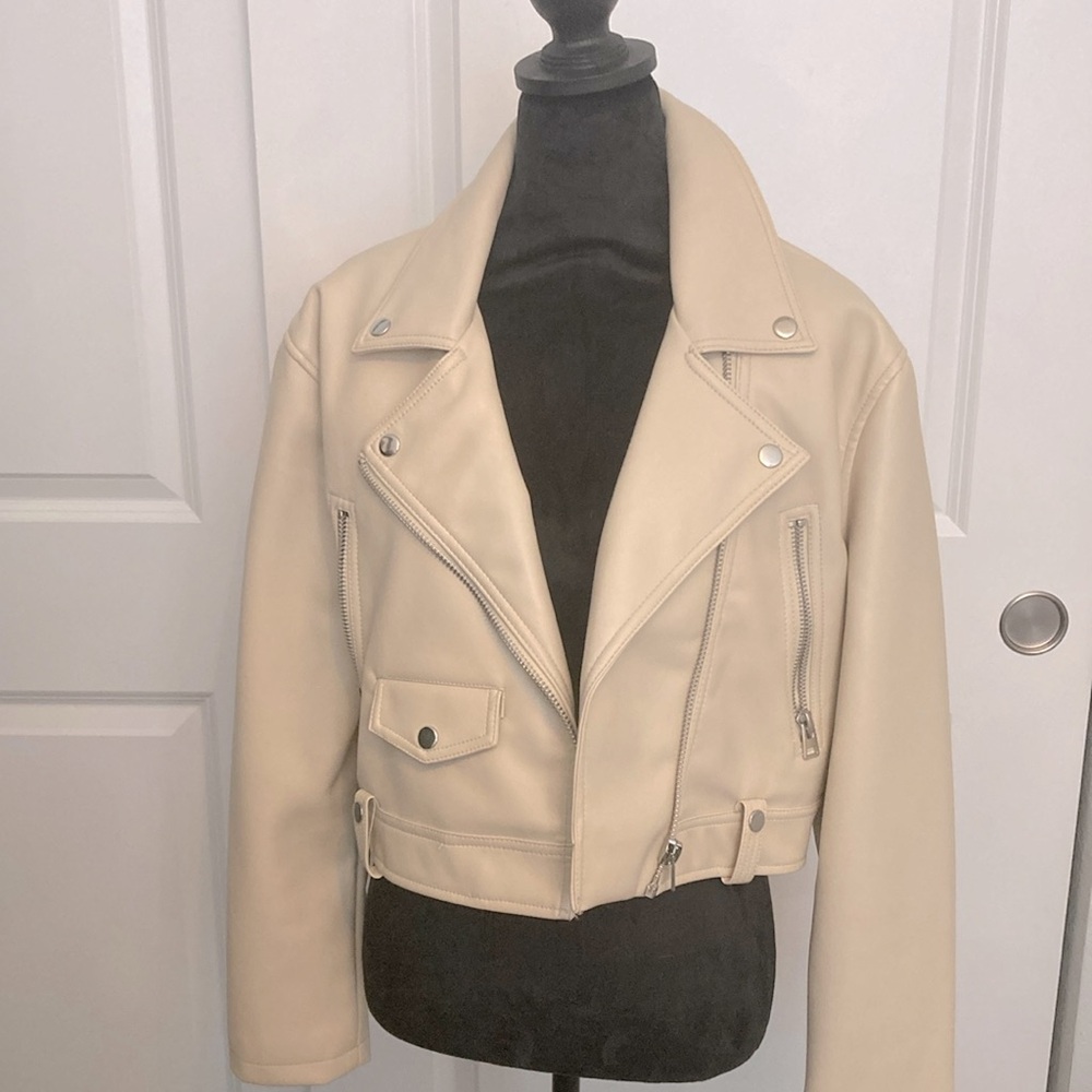 Faux leather cream motorcycle jacket.  The label is Top Shop from Nordstrom‘s.